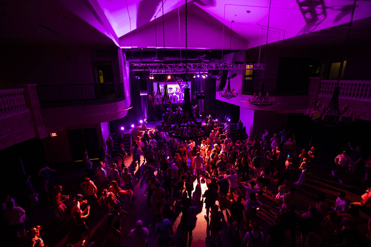 Attendees dance during a 90’s nite party during the first day of the Life is Beautiful f ...