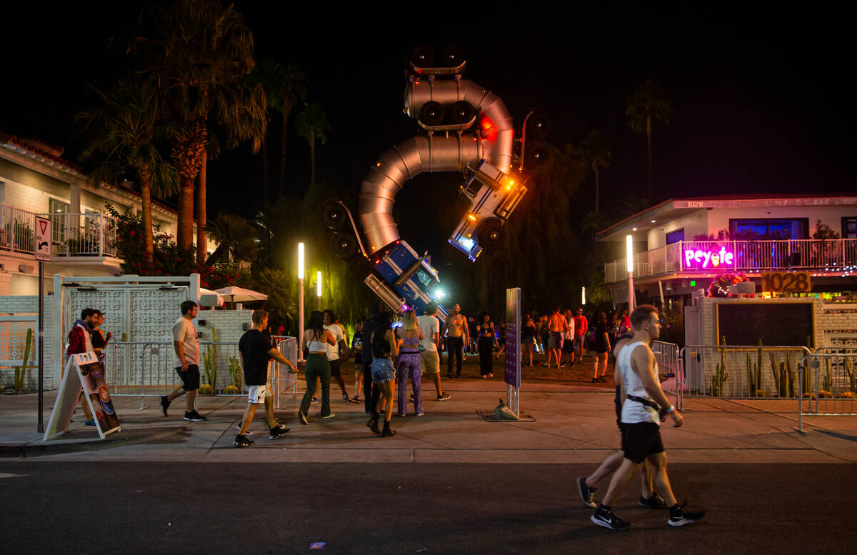 Attendees walk along Fremont Street during the first day of the Life is Beautiful festival on F ...