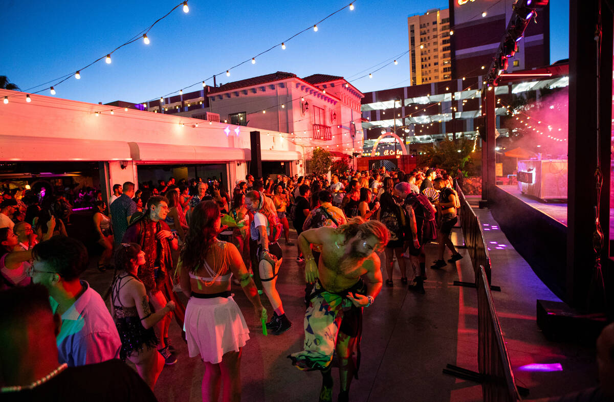 Attendees dance to a DJ during the Life is Beautiful festival on Sunday, Sept. 18, 2022, in dow ...