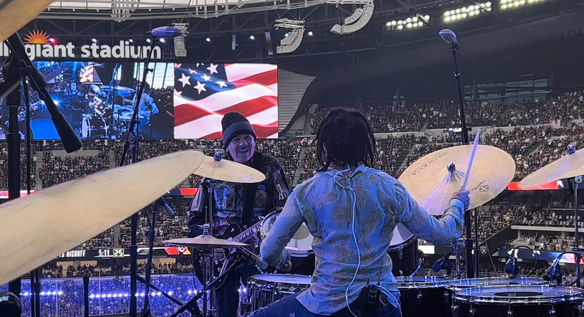 Carlos Santana and his wife, Cindy Blackman Sanatana, perform the national anthem before the Ar ...