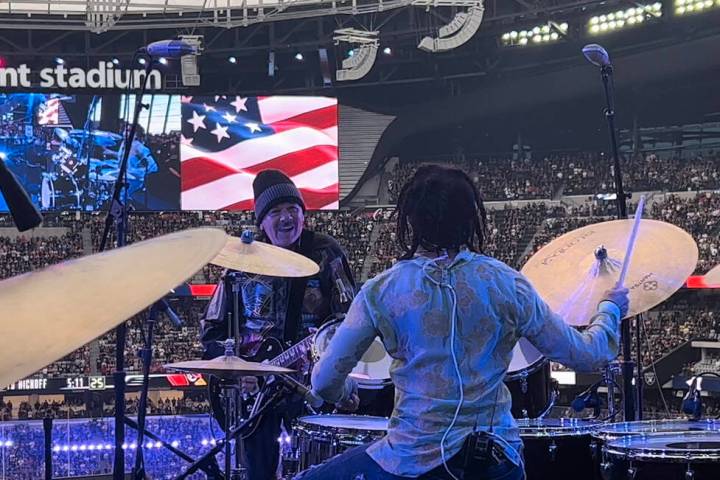 Carlos Santana and his wife, Cindy Blackman Sanatana, perform the national anthem before the Ar ...
