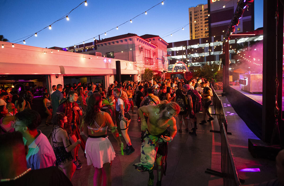 Attendees dance to a DJ during the Life is Beautiful festival on Sunday, Sept. 18, 2022, in dow ...