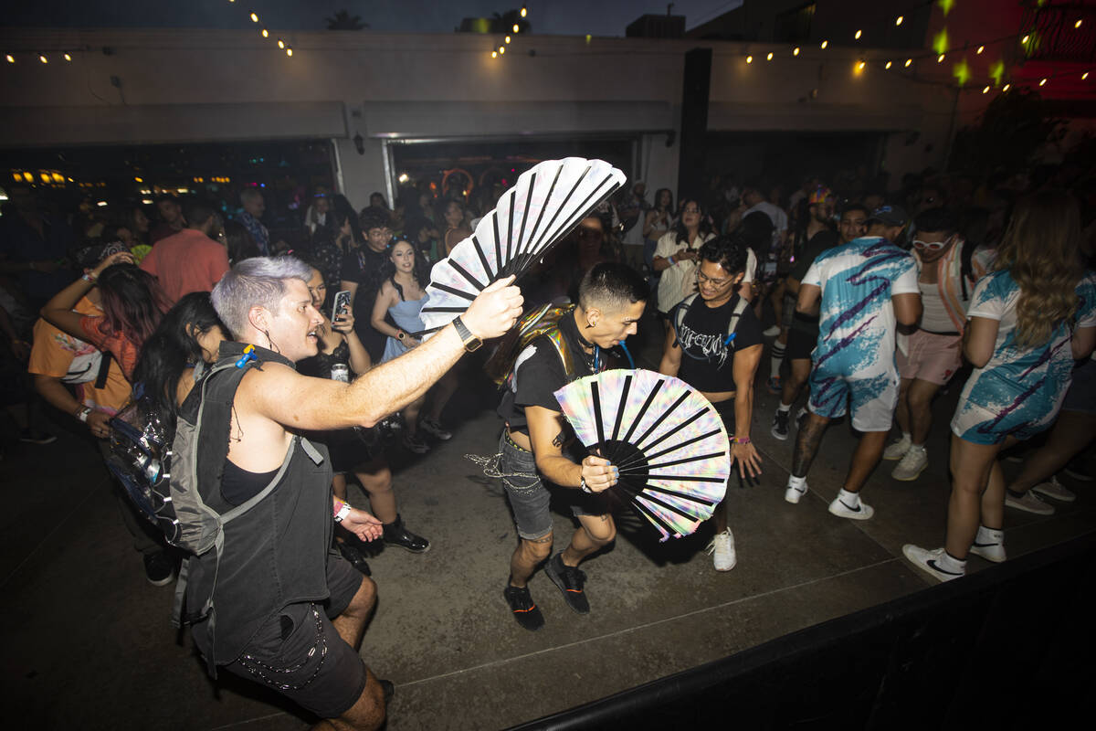 Attendees dance to a DJ during the Life is Beautiful festival on Sunday, Sept. 18, 2022, in dow ...