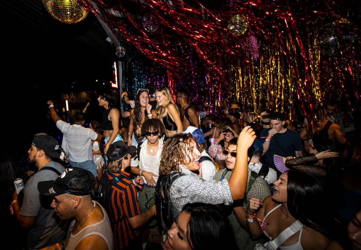 Attendees dance as DJ Angie Vee performs during the Life is Beautiful festival on Sunday, Sept. ...