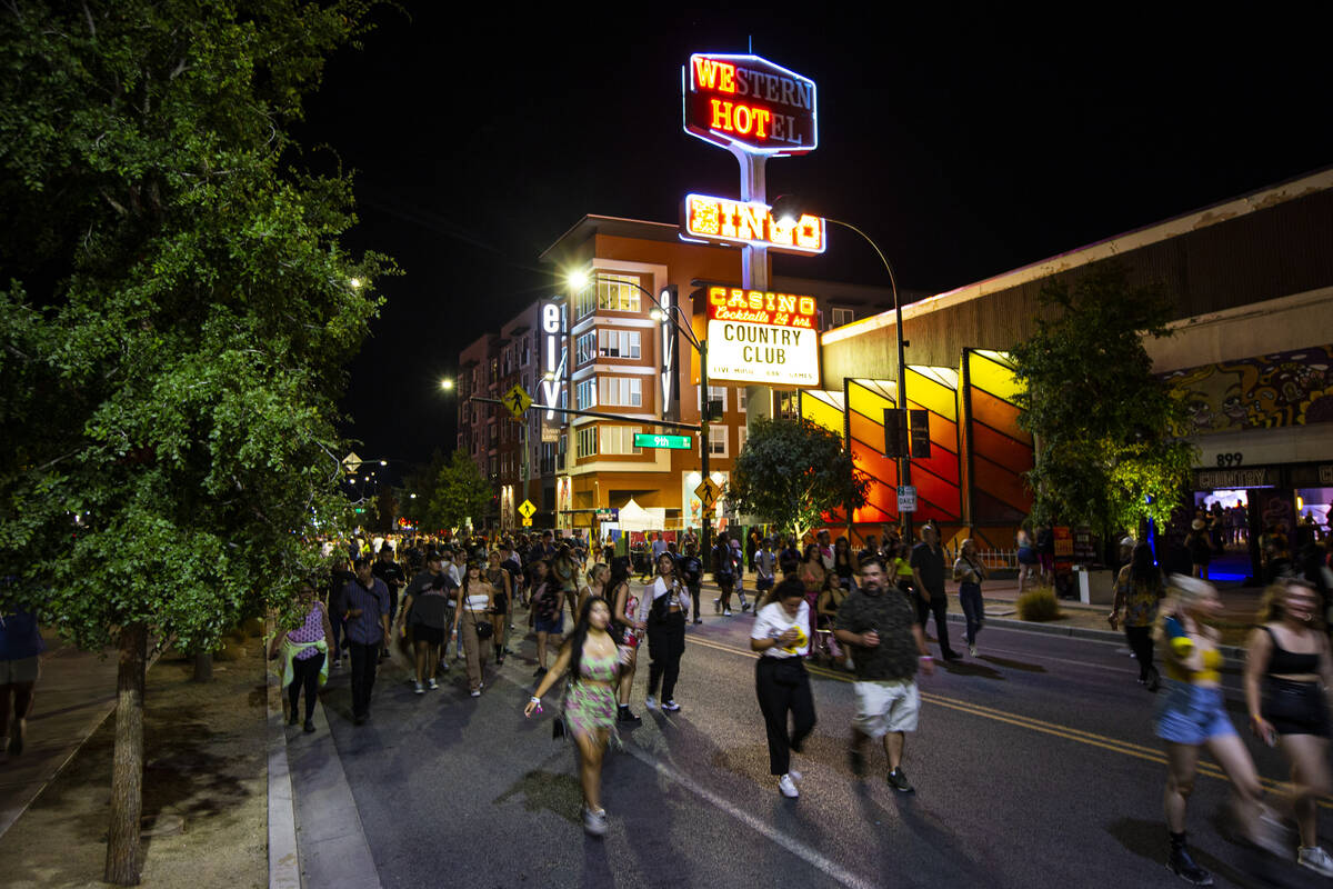 Attendees walk along Fremont Street during the Life is Beautiful festival on Sunday, Sept. 18, ...
