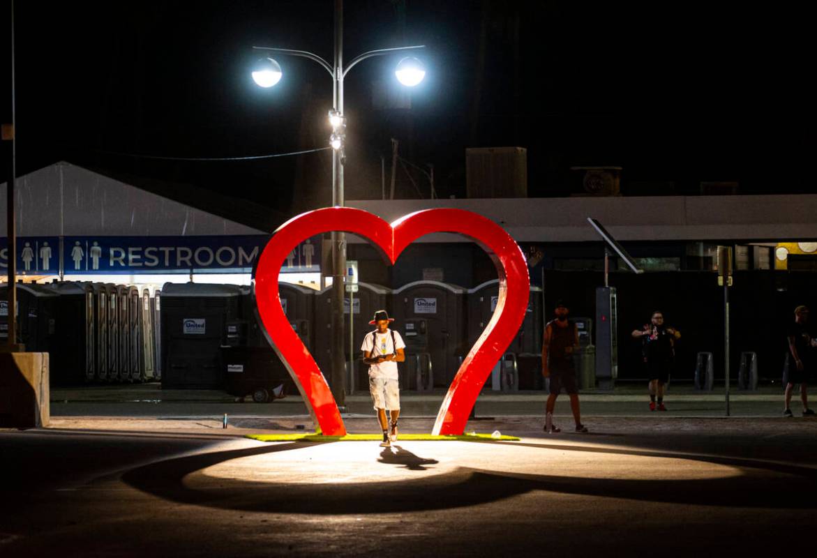 Attendees make their way towards the exits during the Life is Beautiful festival on Monday, Sep ...