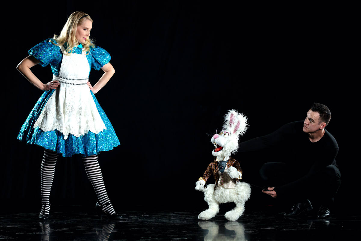 Lauren and Derek Lux are shown in the puppet production "Wonderland," based “Alice’s Advent ...