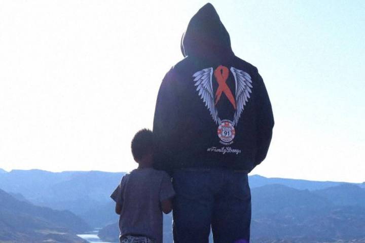 A survivor of the Route 91 Harvest festival with his son. (Paramount+)