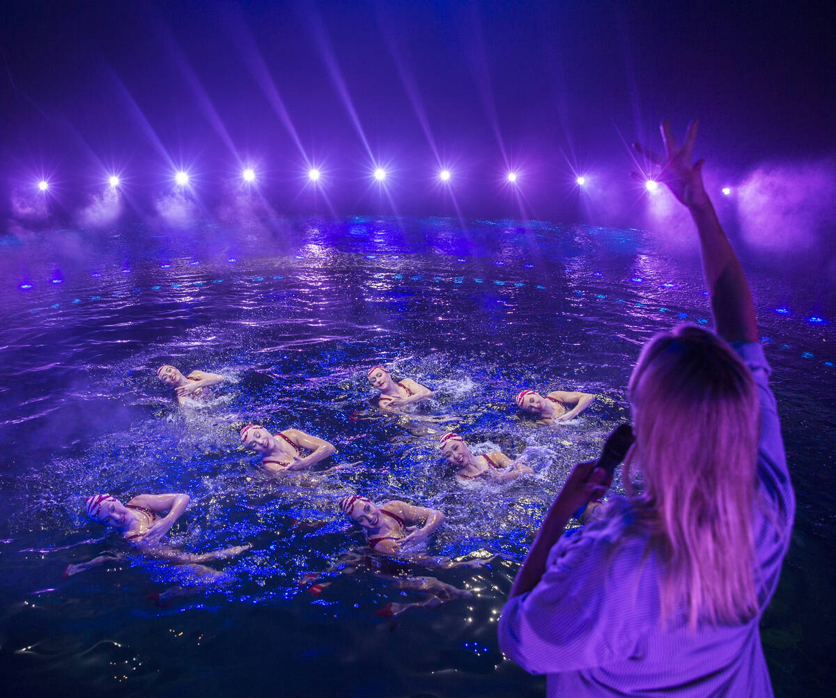 Aquatic coach and choreographer Dacha Nedorezova, bottom/right, gives instruction to synchroniz ...