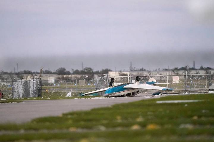 A damaged airplane is seen at the Punta Gorda Airport in the aftermath of Hurricane Ian, in Pun ...
