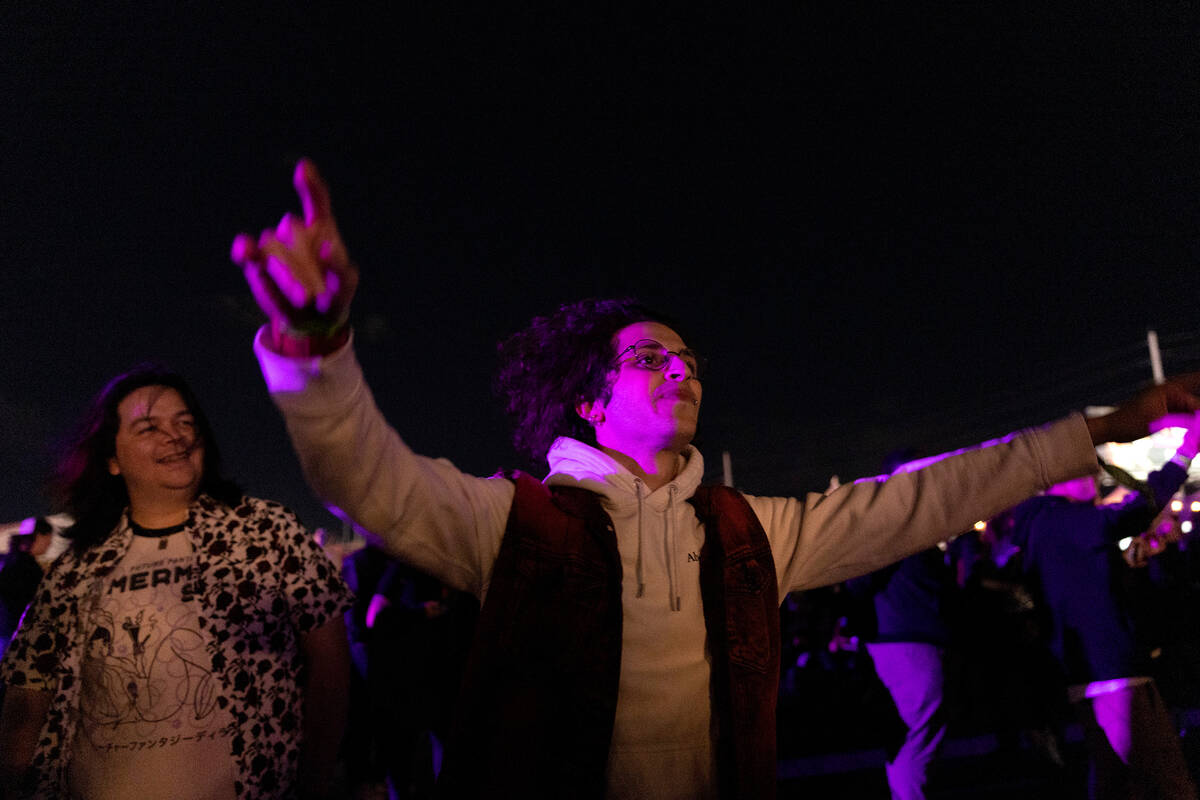 Michael Echevarria, of Daytona Beach, Florida, right, dances to A Day To Remember’s set ...