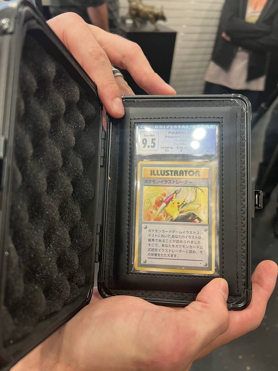 Raiders linebacker Blake Martinez shows his Pokemon Illustrator card at Gold & Silver Pawn on T ...