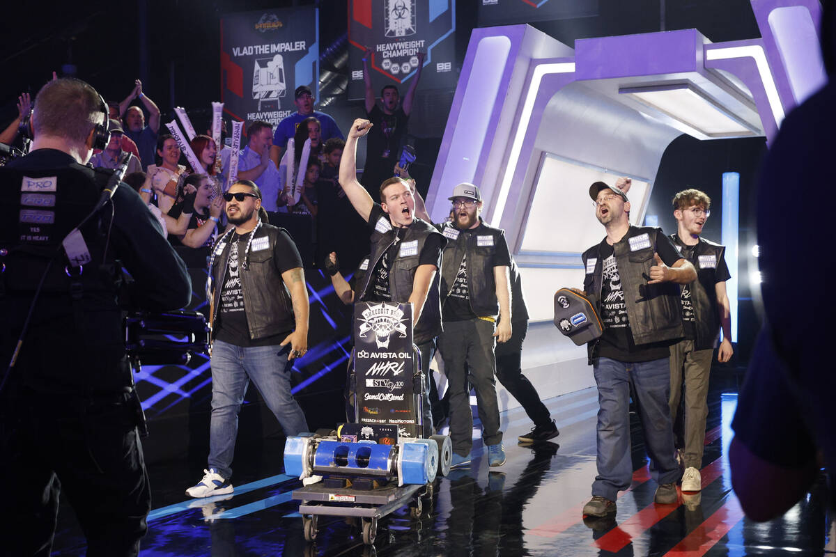 Shreddit team members of Staten Island, N.Y. enter the BattleBots arena with their robot Shredd ...