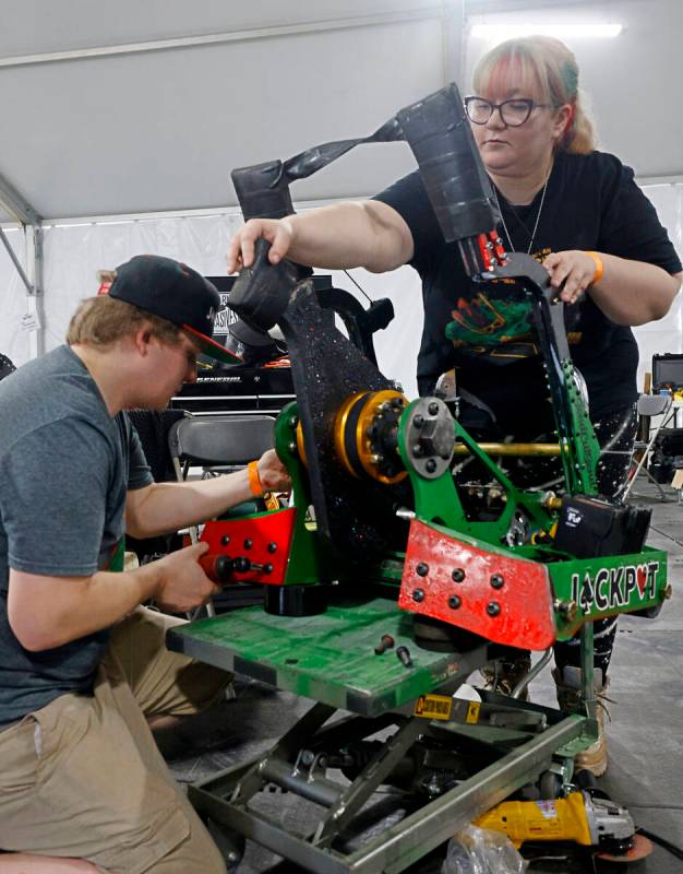 Vegas Combat Robotics team members Lucas Grell and Kat Waters prepare their robot Jackpot for a ...