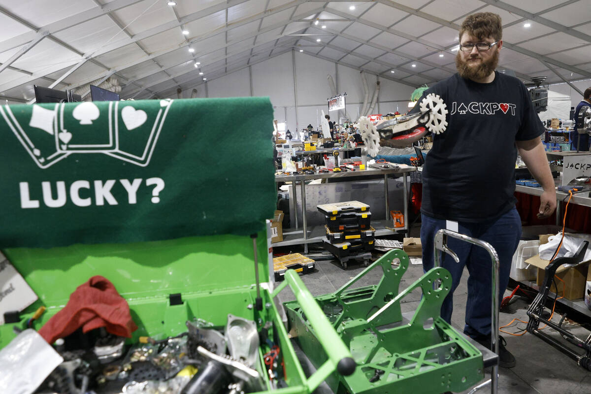 Vegas Combat Robotics team founder Jeff Waters works in the pits during BattleBots World Champi ...