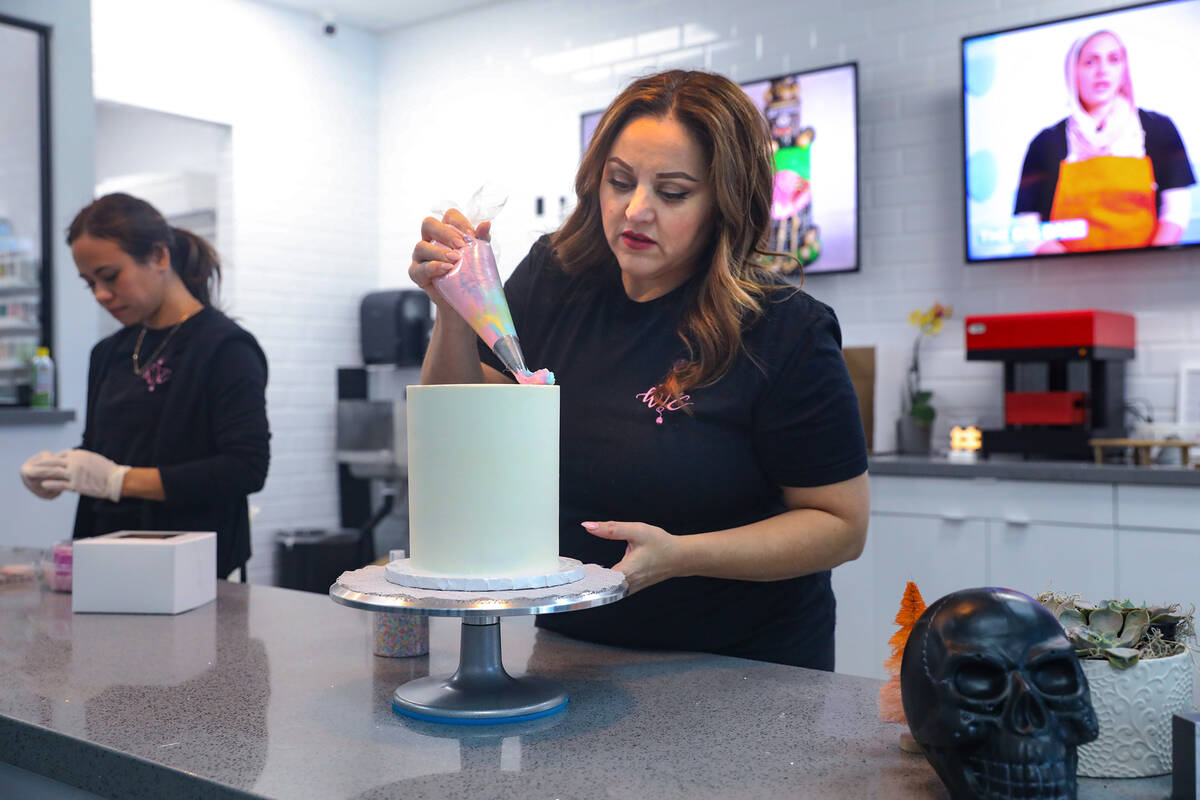 Co-owner Korey Wells frosts a cake at Whiskful Thinking Cakes in Las Vegas, Thursday, Oct. 13, ...