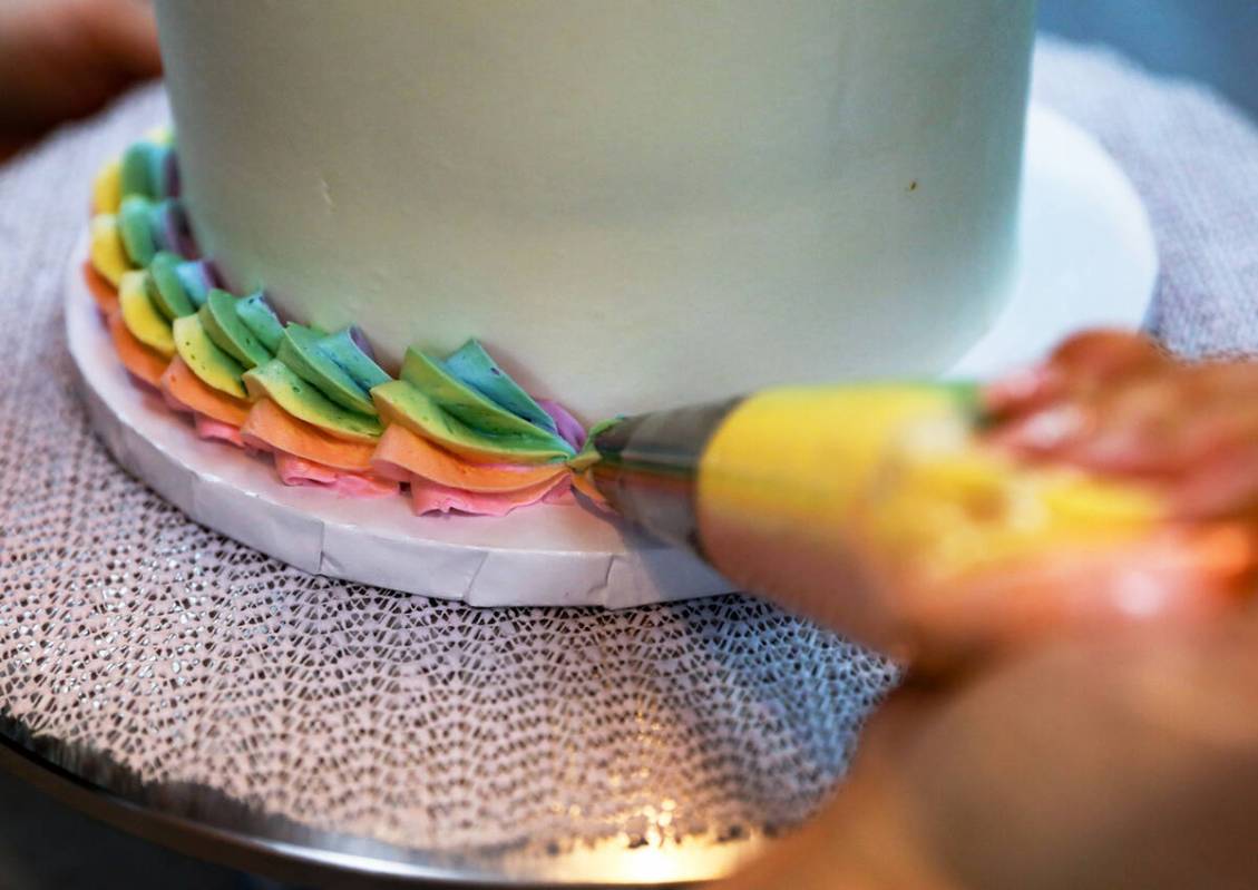 Co-owner Korey Wells frosts a cake at Whiskful Thinking Cakes in Las Vegas, Thursday, Oct. 13, ...