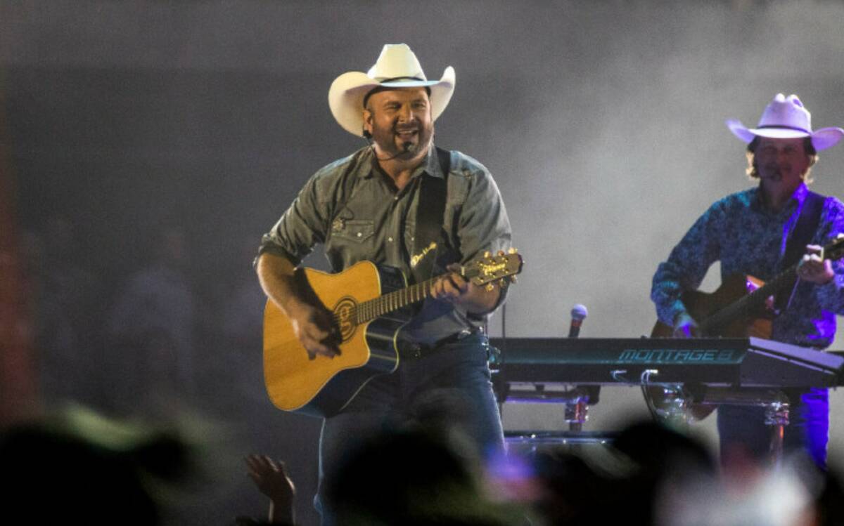 Garth Brooks performs before the crowd at Allegiant Stadium on Friday, July 10 2021, in Las Veg ...