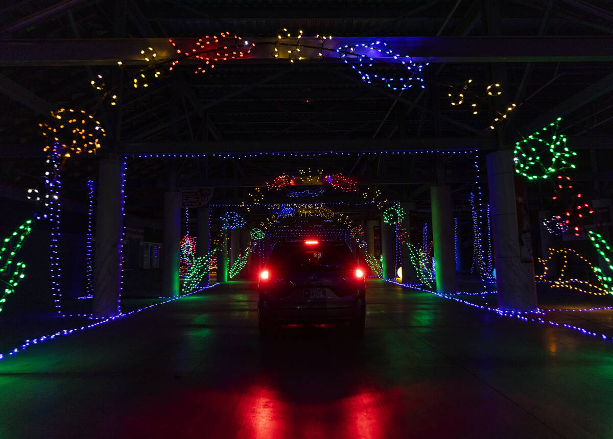 Cars tour through Glittering Lights at Las Vegas Motor Speedway in Las Vegas on Monday Nov. 30, ...