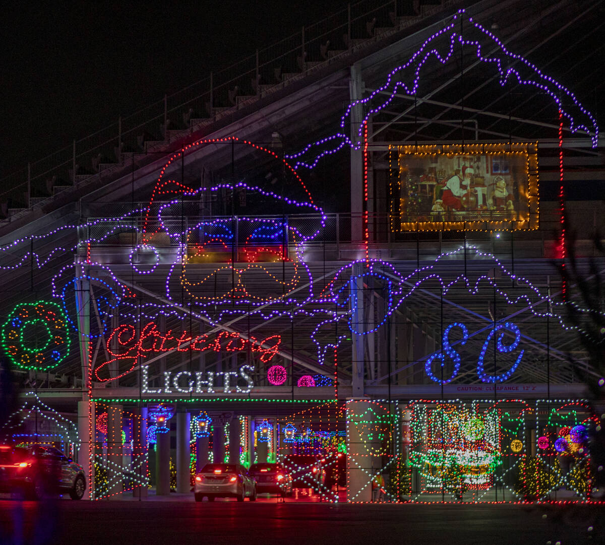 Cars tour through Glittering Lights at Las Vegas Motor Speedway in Las Vegas on Monday Nov. 30, ...