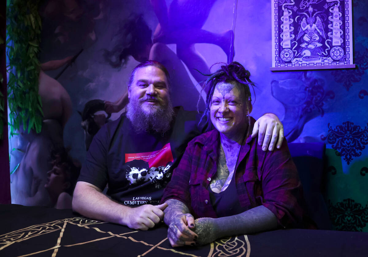 Chris Kmit, left, and Erin Kmit pose for a portrait at their store Cemetery Pulp, a shop of odd ...