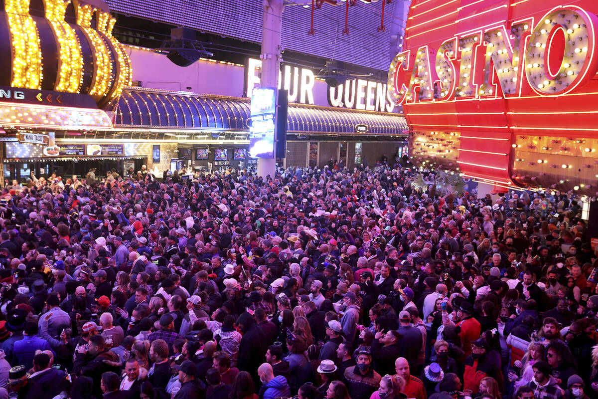 FILE - Revelers celebrate on New Year's Eve at the Fremont Street Experience in downtown Las Ve ...