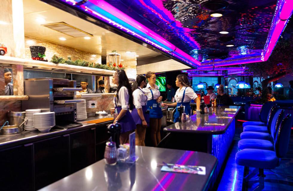 Waitresses wait to take out orders at Peppermill on Wednesday, Dec. 14, 2022, in Las Vegas. (Ch ...