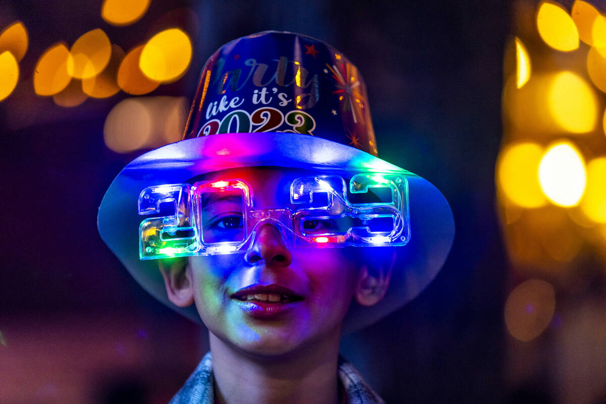 Max Agi, 10, is festive with hat and shade while visiting with his family from Baja, Mexico, on ...