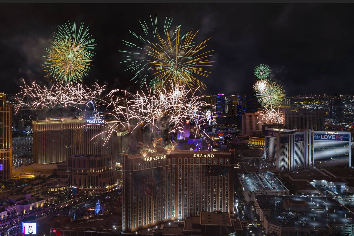 New Year’s fireworks erupt above the Strip viewed from atop the Trump Tower on Sunday, Jan. 1 ...