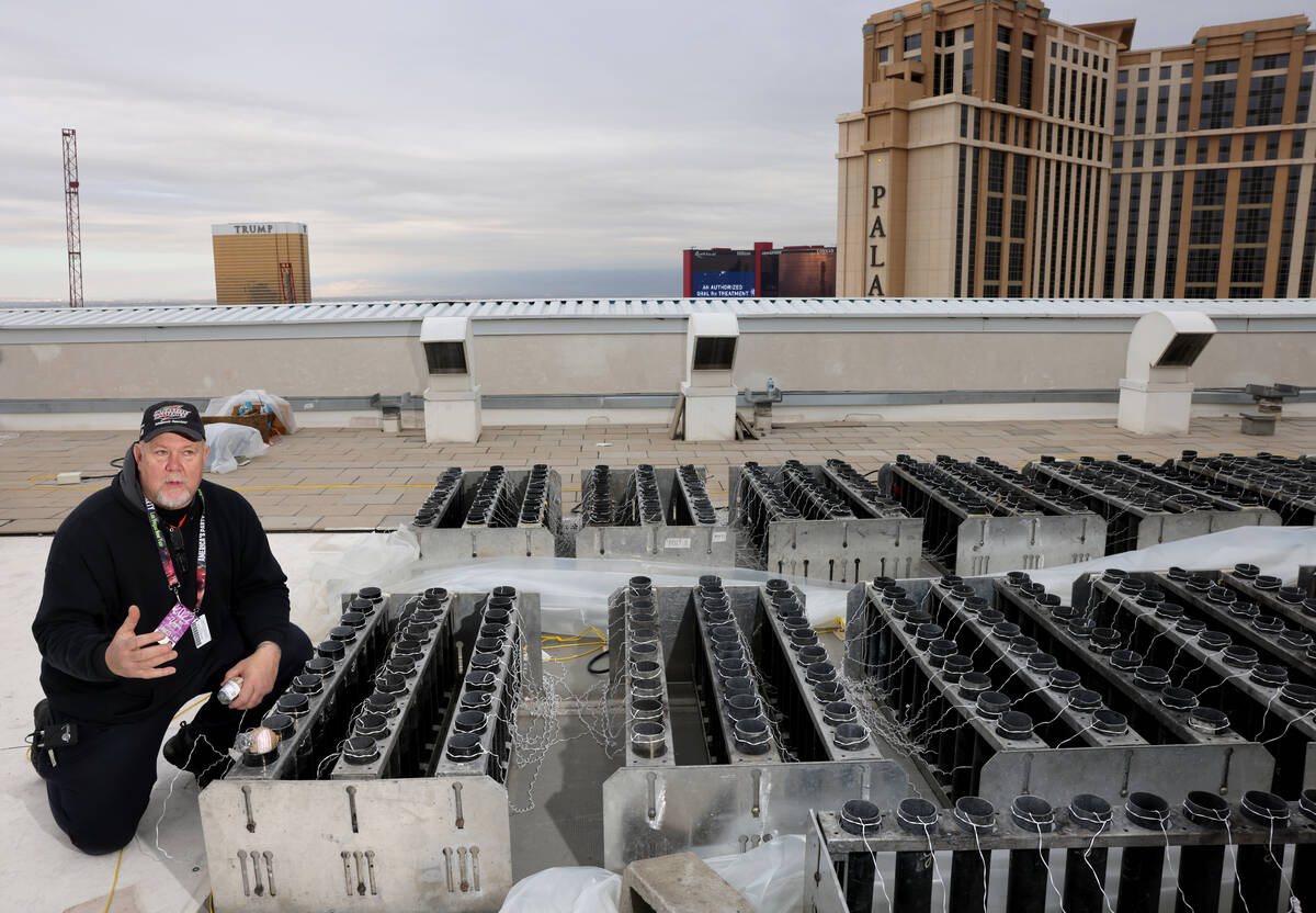 Fireworks by Grucci pyro technician Michael Wassmer loads pyrotechnics on the roof of The Venet ...