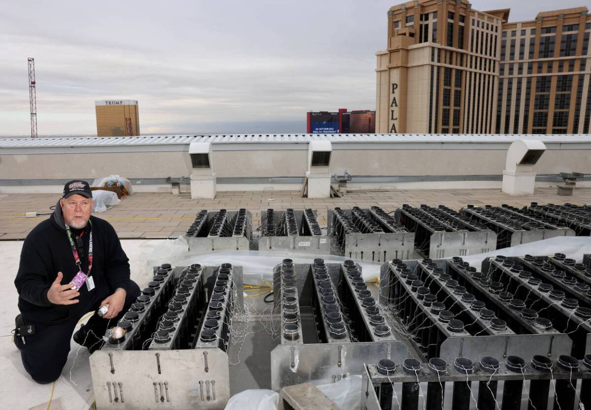 Fireworks by Grucci pyro technician Michael Wassmer loads pyrotechnics on the roof of The Venet ...