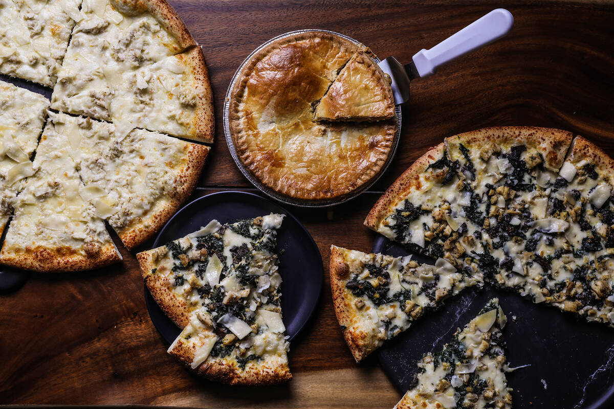 Clockwise from left: the crab pizza pie, the gumbo pot pie, and the Roux pizza pie at Crust &am ...