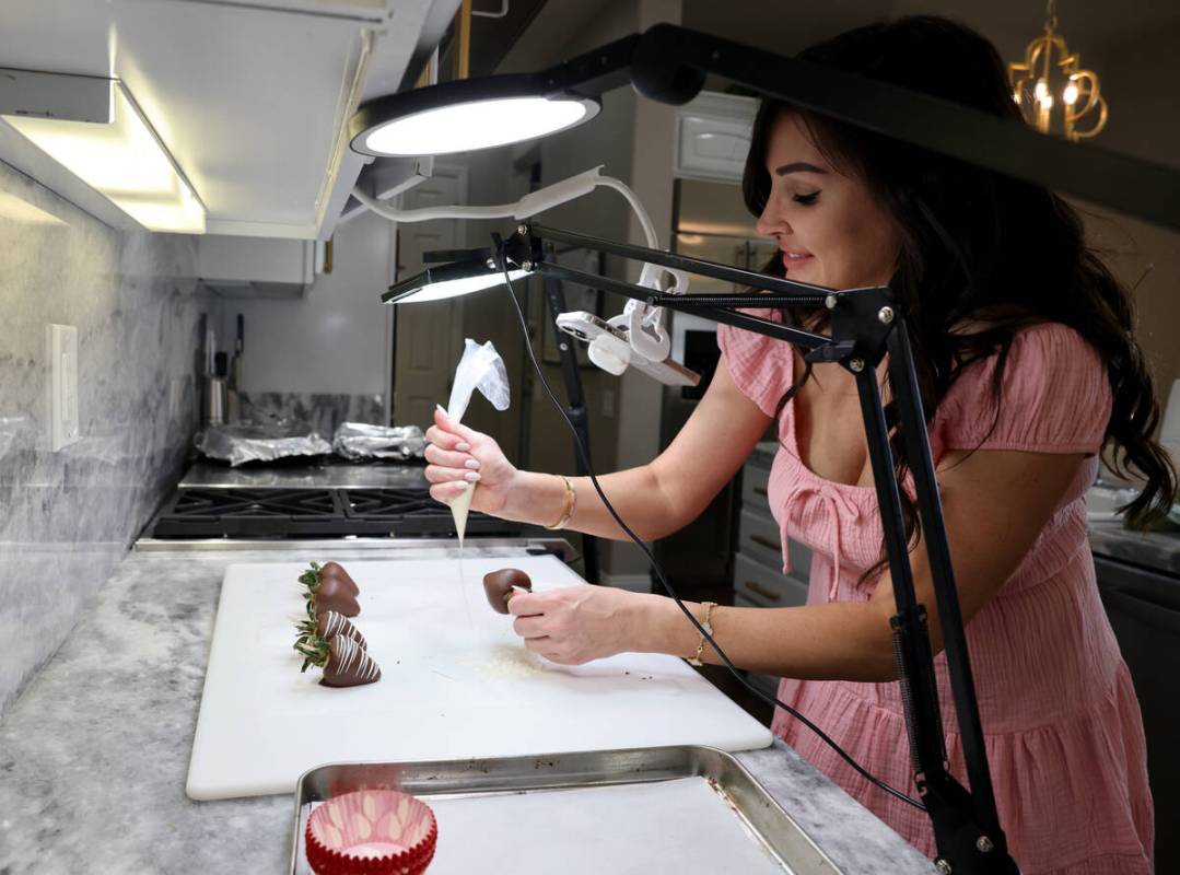 TikTok star Genevieve LaMonaca shows her recipe for chocolate covered strawberries while filmin ...