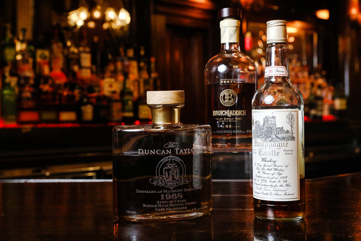 From left: a bottle of Macduff 1968 scotch whisky by Duncan Taylor, Bruichladdich Islay single ...