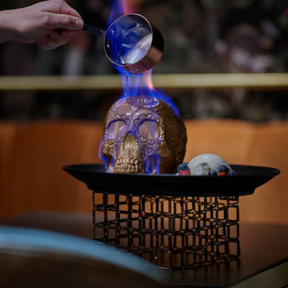 A Flaming Skull dessert (horchata ice cream, fresh fruit, corn marshmallows) from Chica in The ...