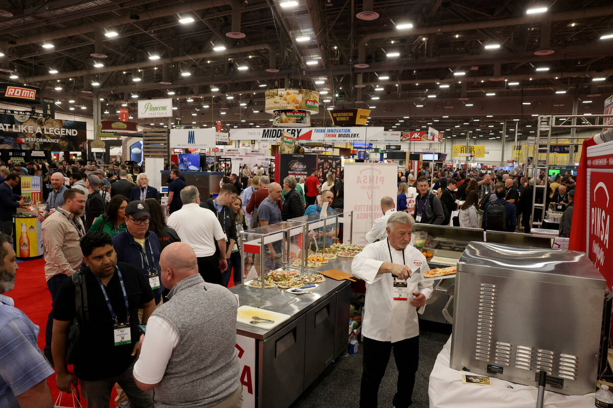 Don Ferguson of Pinsa Romana America prepares a pizza for sampling at the International Pizza E ...
