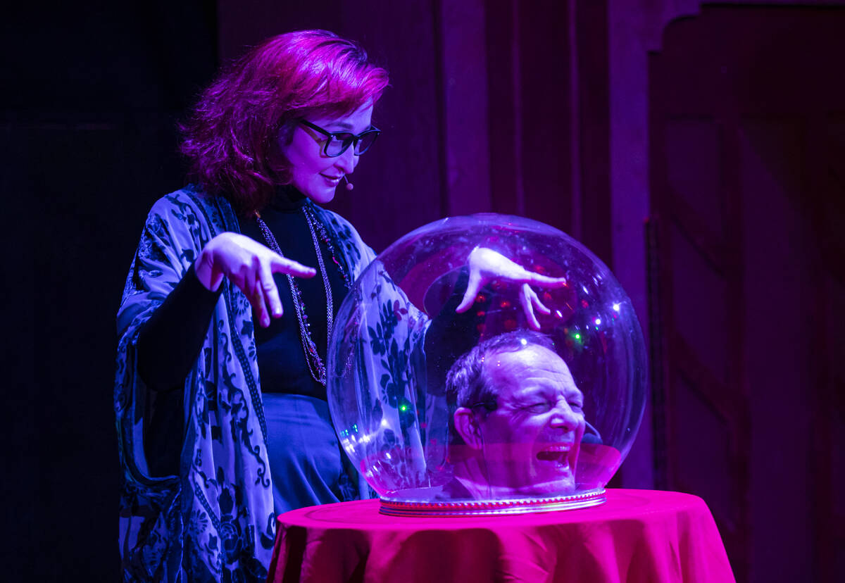 Brandi Glass, left, and Kip Reynolds perform as guests arrive for the The Seance Room at Lost S ...