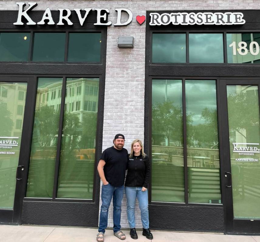 Owners Andy and Meghan Sparks take a moment in front of the new location of Karved, the rotisse ...
