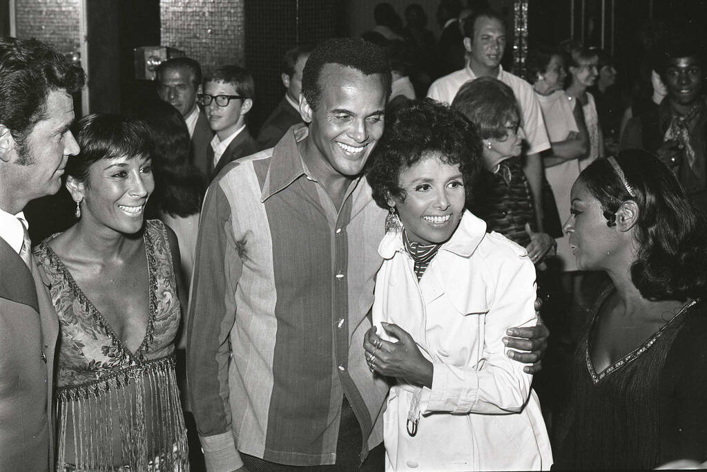 Harry Belafonte, left, and Lena Horne take part in a reception for their show opening at Caesar ...