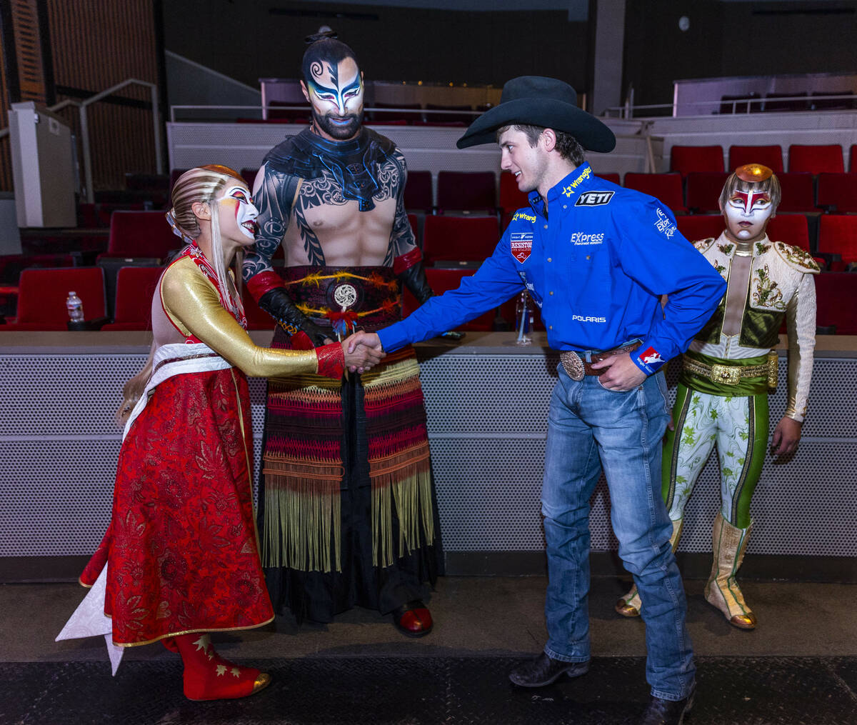 Cast members with "KA" greet Stetson Wright to celebrate the National Finals Rodeo at the Palms ...