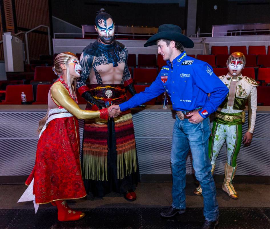 Cast members with "KA" greet Stetson Wright to celebrate the National Finals Rodeo at the Palms ...