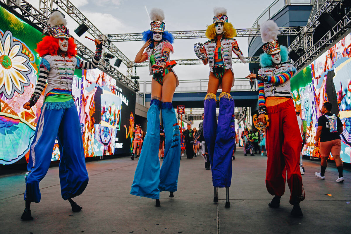 Festival performers dance during the first day of Electric Daisy Carnival at Las Vegas Motor Sp ...