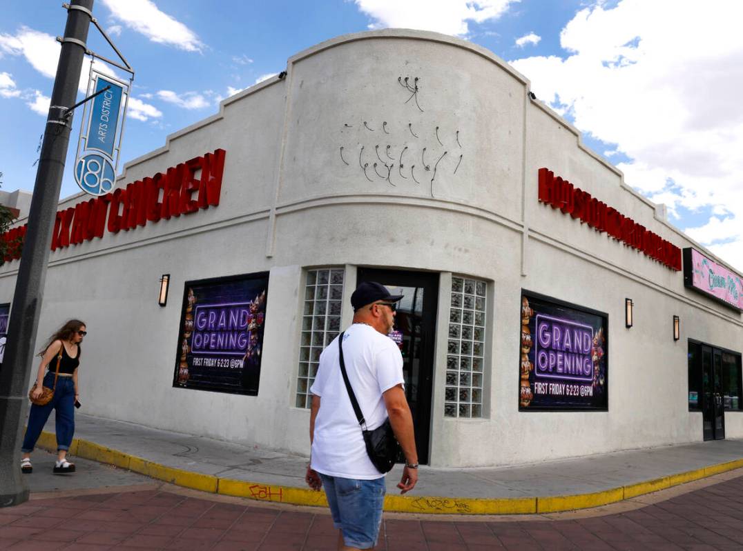 Pedestrians walk past the new Houston Hot Chicken at 1201 S Main St., in downtown Las Vegas, on ...