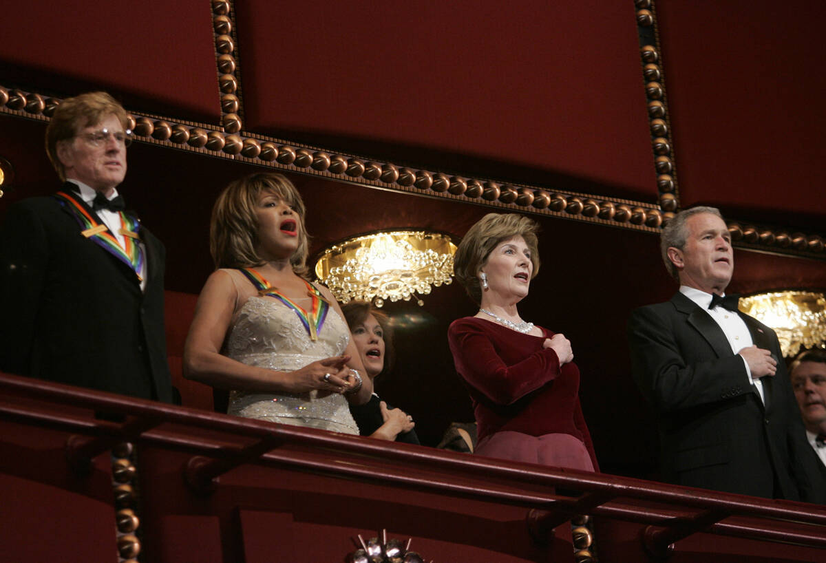 President Bush, right, and first lady Laura Bush, second from right, stand with actor Robert Re ...