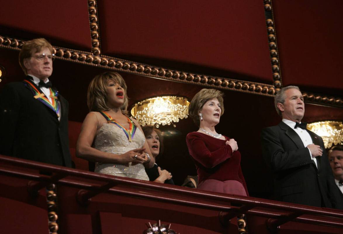 President Bush, right, and first lady Laura Bush, second from right, stand with actor Robert Re ...