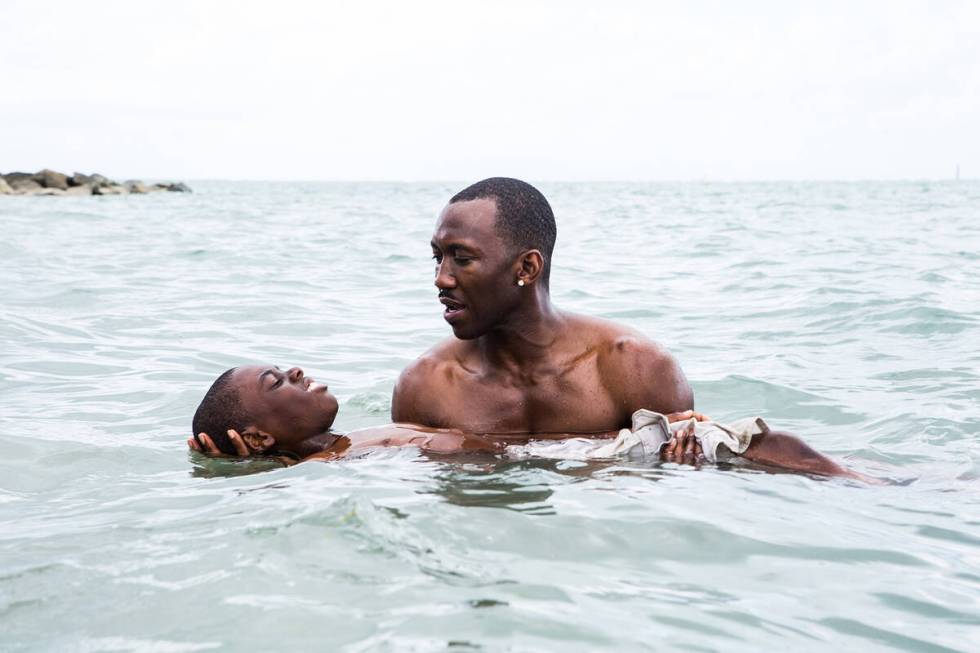Alex Hibbert and Mahershala Ali star in "Moonlight." Credit: Photo by David Bornfrien ...