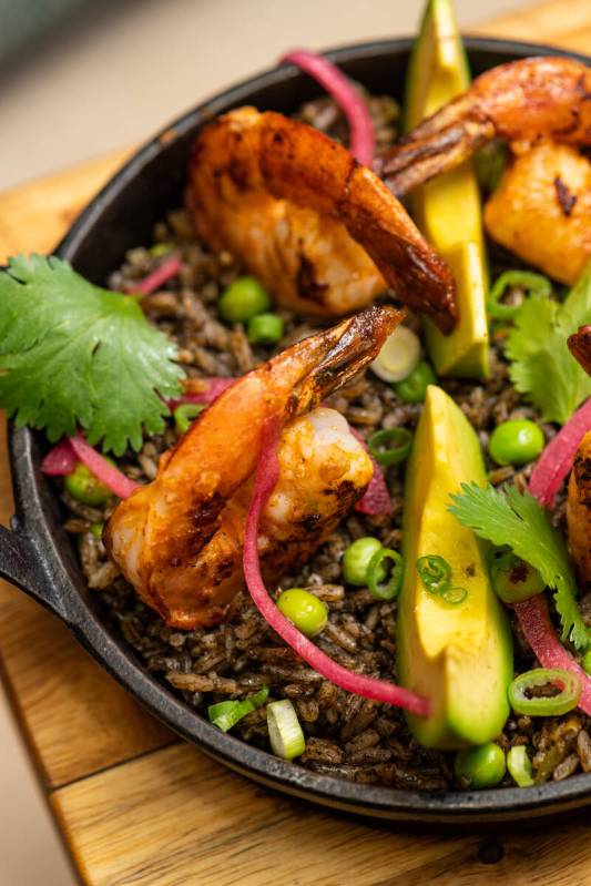 Seafood with squid ink rice is among the dishes being served at Chica in The Venetian on the St ...