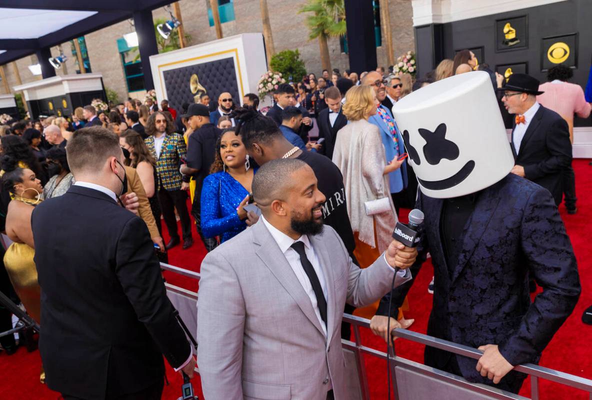 Marshmello, right, on the red carpet before the start of the 2022 Grammy Awards on Sunday, Apri ...