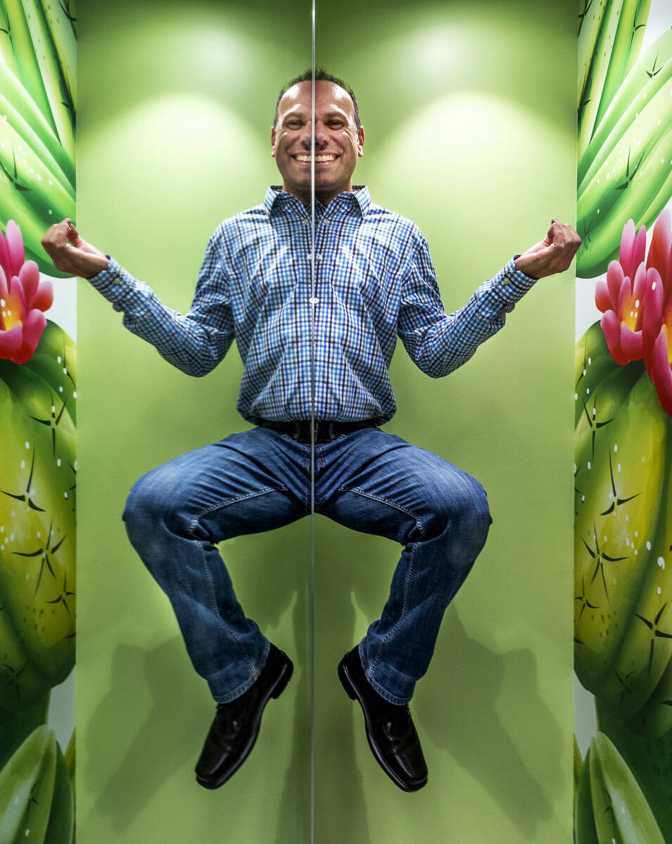 Sales and marketing manager Billy Pierro appears to elevate and is mirrored in half in the Symm ...