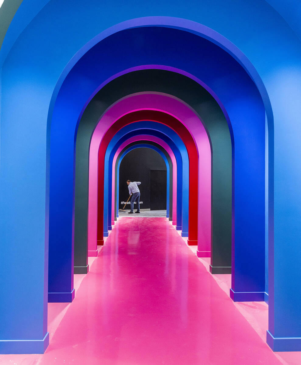 Sales and marketing manager Billy Pierro sweeps the floor at the end of a multi-colored passage ...